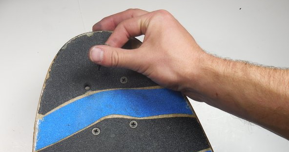 Removing a bolt from a skateboard