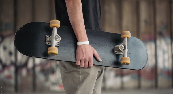 Holding a skateboard
